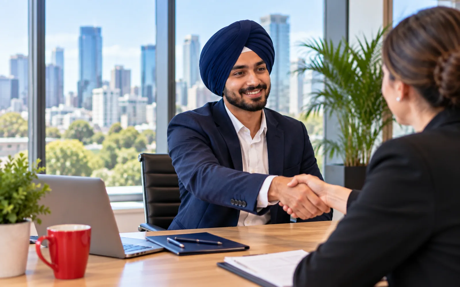 Graduate shaking hands after a job interview